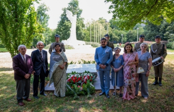 Floral tributes at the Memorial to the Kolhapur family in Warsaw